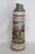 This wonderful Extra Tall Beer Stein is made of ceramic with a pewter lid opened with a winged cherub. The graphic on the...