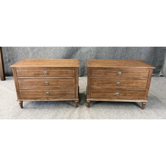 This pair of Restoration Hardware Maison Collection 38″ nightstands reflects late 18th-century French design with clean...