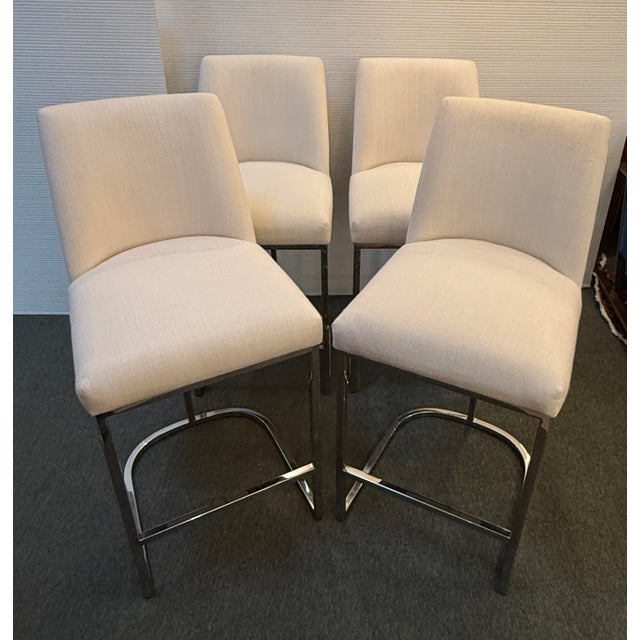 Design Plus Gallery presents a Set of Four Emery Bar Stools from Restoration Hardware. The stools have a curved...