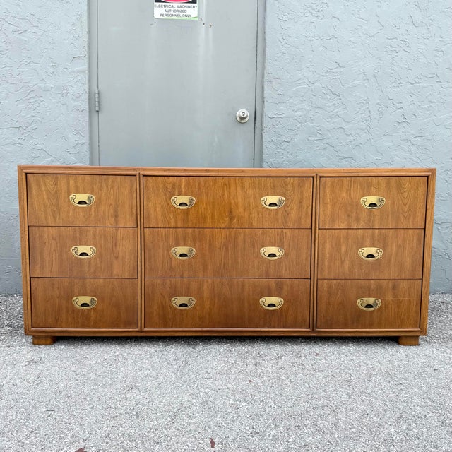 A handsome vintage dresser from Drexel’s Passages collection, featuring a warm walnut finish and classic Campaign-inspired...