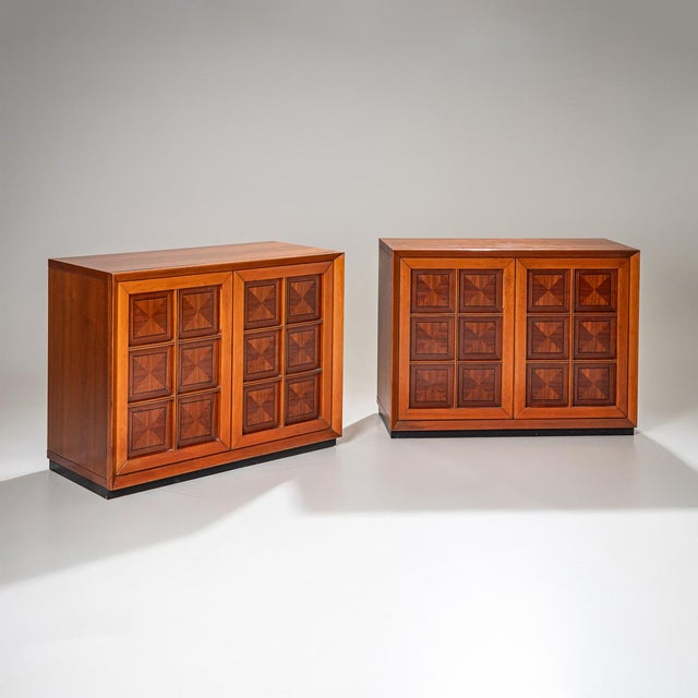 A striking pair of sideboards from the 1970s featuring the signature geometric design of Mobili i Caccia alla Volpe. The...