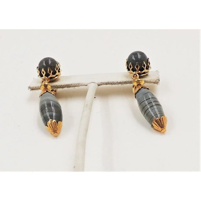 This is part of Chairish’s Costume Jewelry assortment. 1960s goldtone and faux-grey agate with prong set cabochon top and...