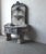 This is a beautifully weathered European style, cast stone wall fountain featuring a lion's head spout, shell-form basin,...