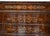 Antique Charles X French chest of drawers in walnut burl with maple inlays and a marble top. The front is punctuated by...
