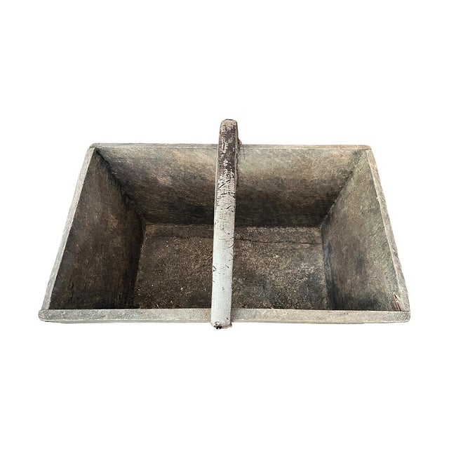 This large, sturdy wooden basket is an excellent vessel for storing decorative objects or creating a stunning floral...