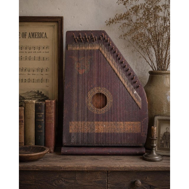 Bring the charm of early American parlor music into your home with this antique folk art zither (lap harp), dating from...