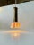 A small and possibly bespoke hanging light composed of a turned onyx marble shade an over-sized top in solid patinated...