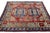 This Kazak wool rug is handcrafted with great attention to detail. It features a rich red palette with delicate blue,...