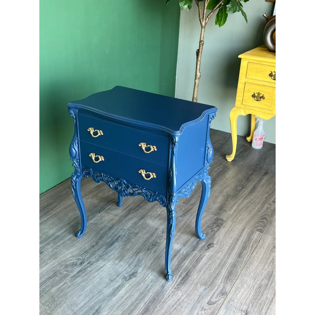 This is a solid built French Provincial blue nightstand This nightstand has rococo-inspired carved embellishments and...