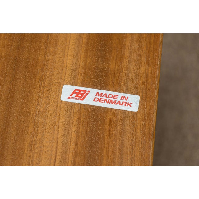 A vintage FBJ Mobler side table on caster wheels. This chic side end table features a 1970s design by FBJ Mobler,...