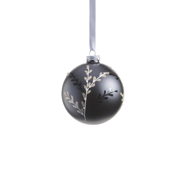 Elevate your holiday décor with our sophisticated matte black glass ball ornaments. Featuring an exquisite leaf pattern...
