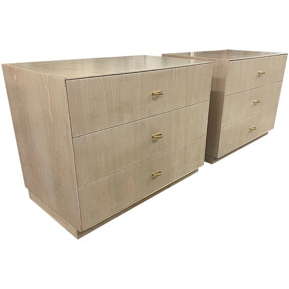 Matching three-drawer chests featuring a light cerused oak or whitewashed oak finish. Clean, fully rectilinear case design...