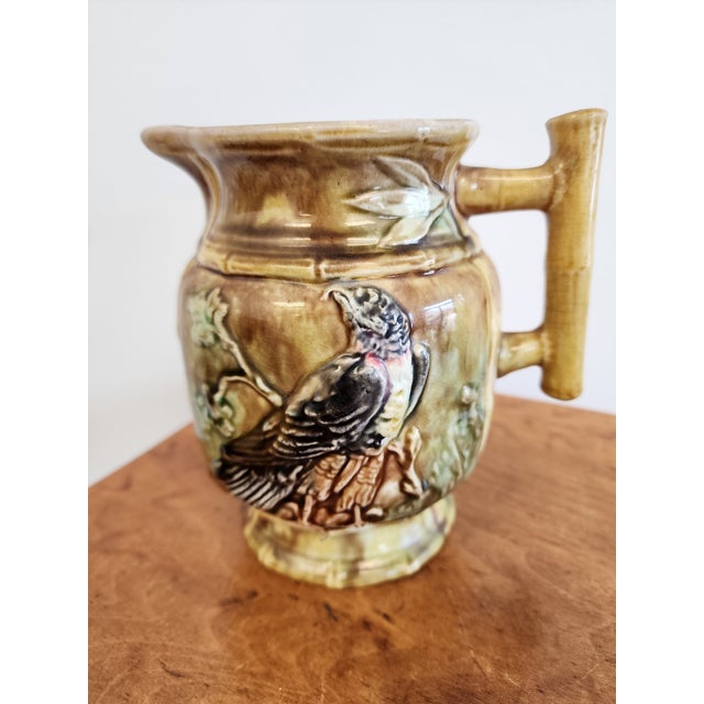 Beautiful Antique Thomas Forester majolica pitcher/jug circa 1890. Hand painted flora and fauna design with lavender...