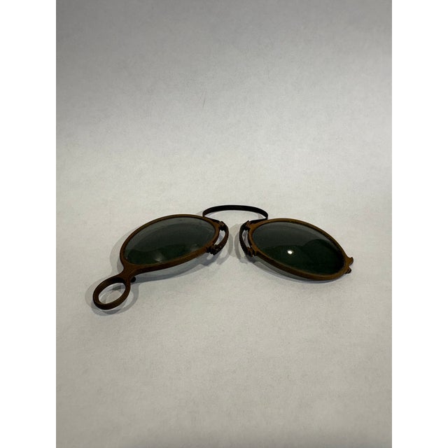 This is a pair of antique Pince-Nez (French for pinch nose) folding eyeglasses. They are circa the late 19th century. They...