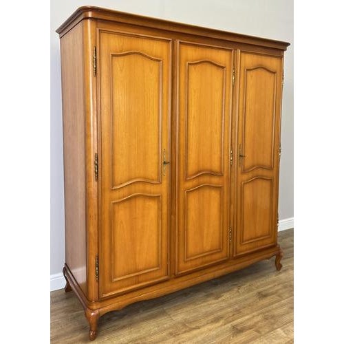 This elegant Vintage French Louis wardrobe presents refined craftsmanship with clean panelled doors, graceful shaping, and...