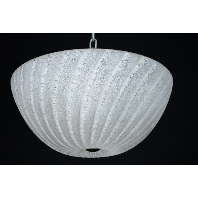 Elegant Murano glass ceiling lamp produced in Italy in the 1980s by Barbini. The lamp features a large, hand-blown glass...