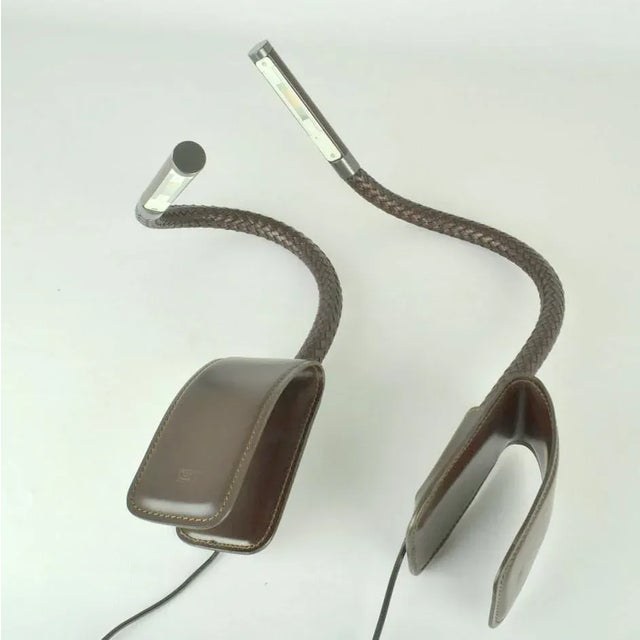 Pair of clip on reading light by Poltrona Frau Italy with touch screen with LED on flexible metal arm covered with...