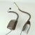 Pair of clip on reading light by Poltrona Frau Italy with touch screen with LED on flexible metal arm covered with...