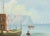 Italian seascape of fishing boats and the shore with ocean cliffs in the background by an unknown artist. Signed...