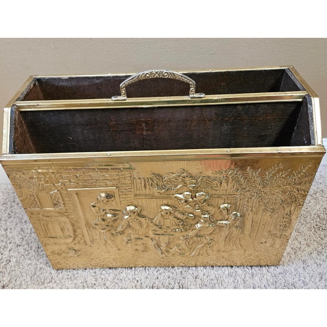 Brass magazine rack. Made with embossed brass overlaid on a solid wood frame.