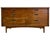 Mid century modern dresser featuring a clean, low-profile silhouette with six spacious drawers arranged in a symmetrical...