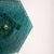 This beautiful pair of wall lights features a cylindrical gold base topped with a hexagonal turquoise glass shade. The...