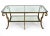 An impressive oversized vintage coffee table featuring a gilt iron frame with elegant scrollwork, curved legs, and two...