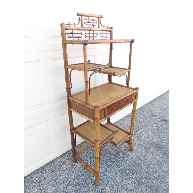 Antique English chinoiserie style bamboo etagere, c.1880. A good looking a d well made bamboo etagere. Having a detailed...
