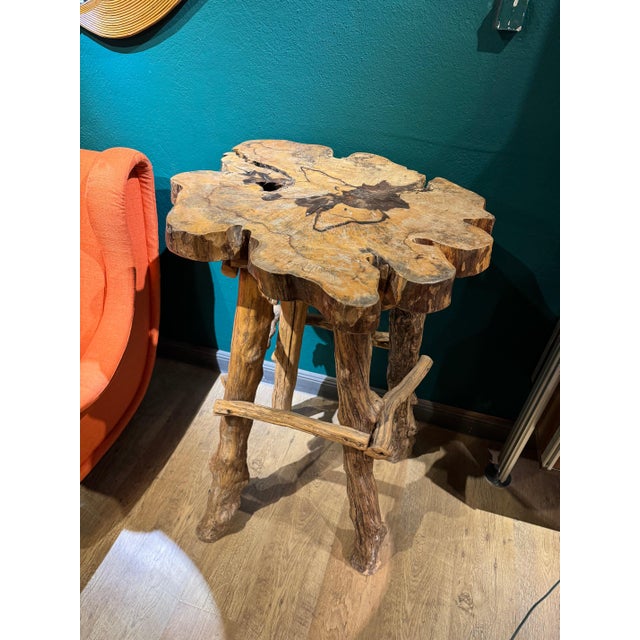 French 20th c. tall slab top live edge table. Four legs are made from the smaller knobby branches of the tree. Found in...