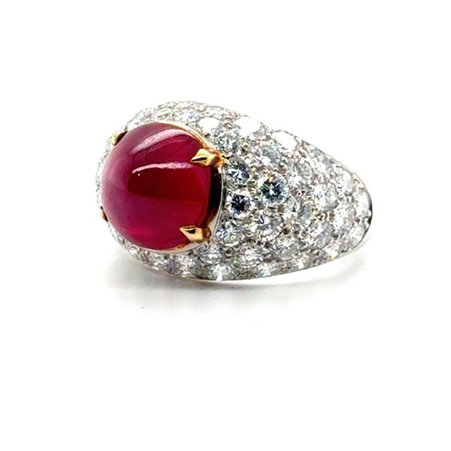 Platinum ring with one 8.61 carat Burma, no heat, cabochion ruby and 3.31 carats of pave set round brilliant diamonds....
