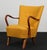 Alfred Christensen lounge chair new upholstered with yellow wool. Armrests and legs of walnut. Made in the 1940s by...