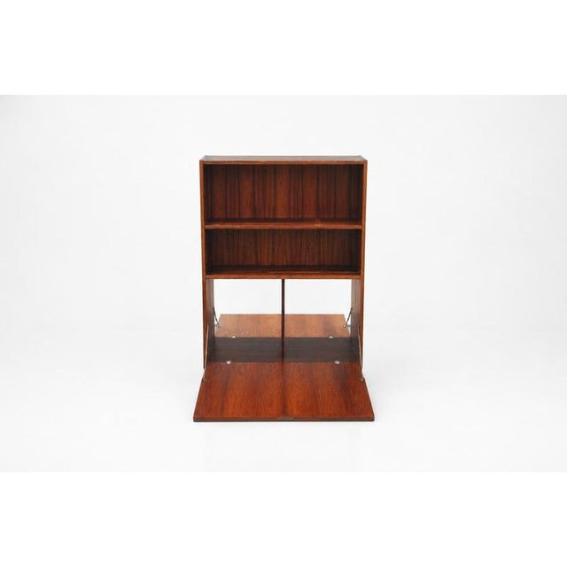 Beautiful wooden veneer cabinet manufactured in Denmark by Poul Hundevad & Co. It features adjustable shelf at the top and...