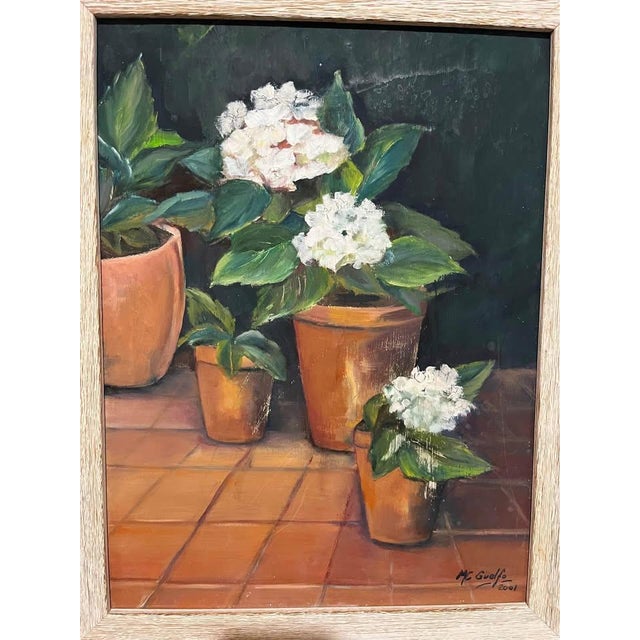 A timeless still life that proves the classics never wilt. This original painting—oil, likely—by M. Guado (2001) features...