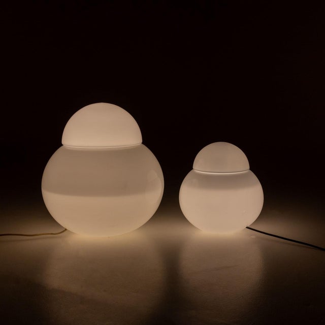 Two 'Daruma' table lamps designed by Sergio Asti for Fontana Arte in 1968. The lamps feature two spherical bodies made of...