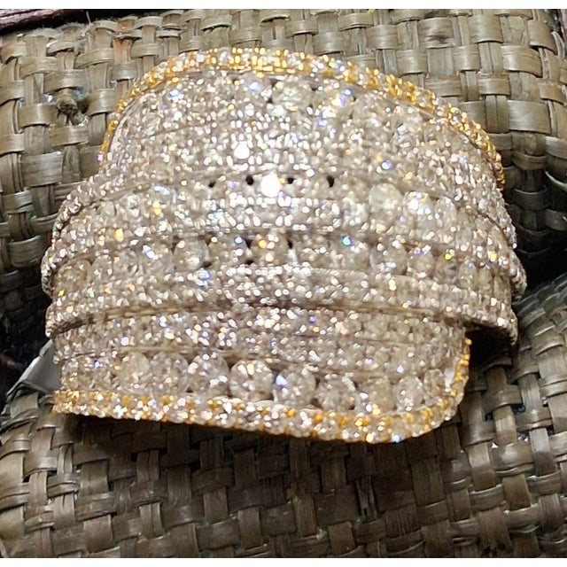 Make a striking statement with this substantial 10K yellow gold natural diamond cluster ring. Designed with a bold 23 mm...