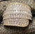 Make a striking statement with this substantial 10K yellow gold natural diamond cluster ring. Designed with a bold 23 mm...