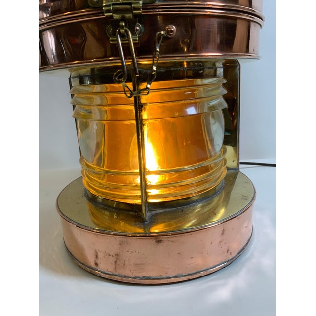 Highly polished copper ships lantern by Davey of London. Approved by the ministry of transport. Hinged top. Electrified...