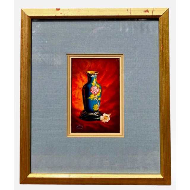 Vibrant still life oil painting by listed artist Kay M. Hendricks, featuring a detailed cloisonné-style vase on a dramatic...