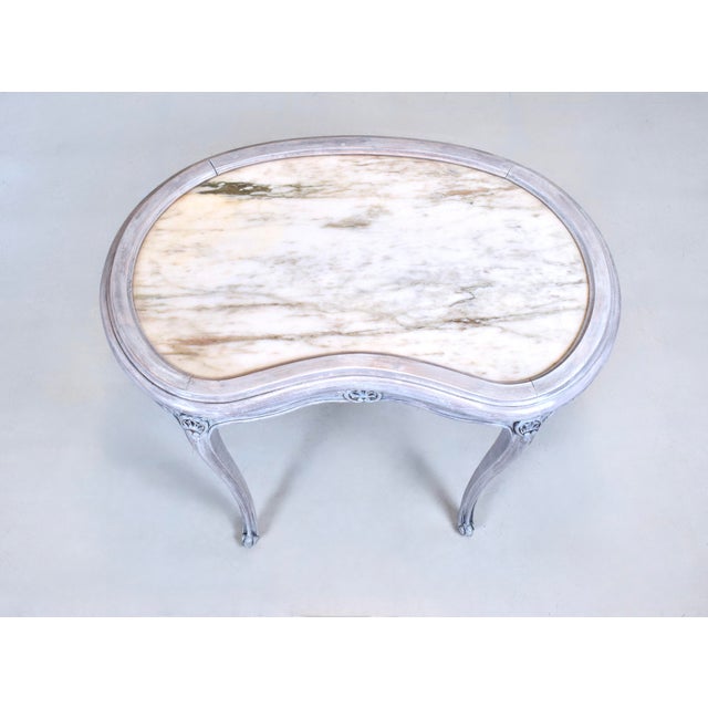 1940's Louis XV style kidney shape side table with substantial inset marble top & elegant cabriole legs. Soft translucent...