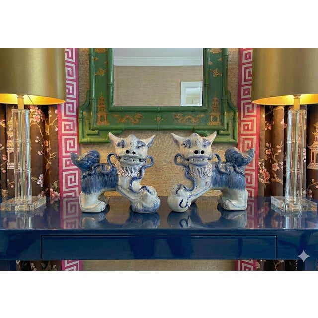 Guardians of style, keepers of the chic. This exquisite pair of 1980s vintage porcelain Foo Dogs (or Guardian Lions)...