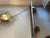 1980s Art Deco wall shelf with decorative silver-plated metal brackets and a recessed black marble shelf with a rustic...