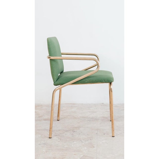 A stunning and elegant set of four vintage armchairs dating back to the 1970s, perfectly embodying the refined and...