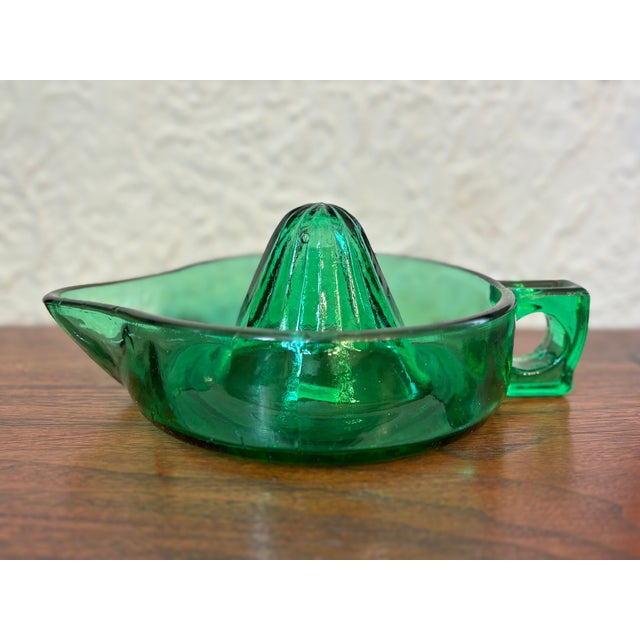 Circa 1960s dark green glass juicer. Handsome and useful. Most items found at Pub & Oasis are vintage and antique in...