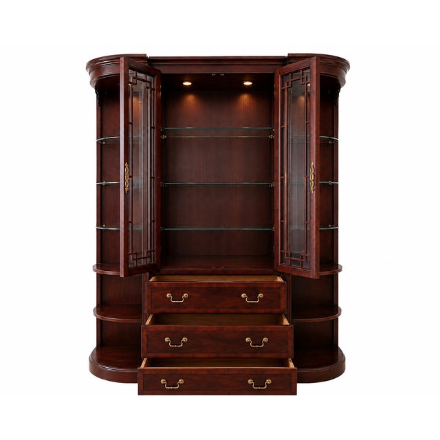 An elegant Drexel Heritage Chippendale three-piece display cabinet, offered by Landon Lane Designs on behalf of one of our...