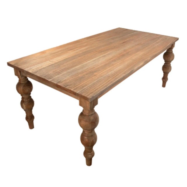 Reclaimed elm wood dining table with carved ball leg design. Each unique in exact wood tones, grain, and natural...