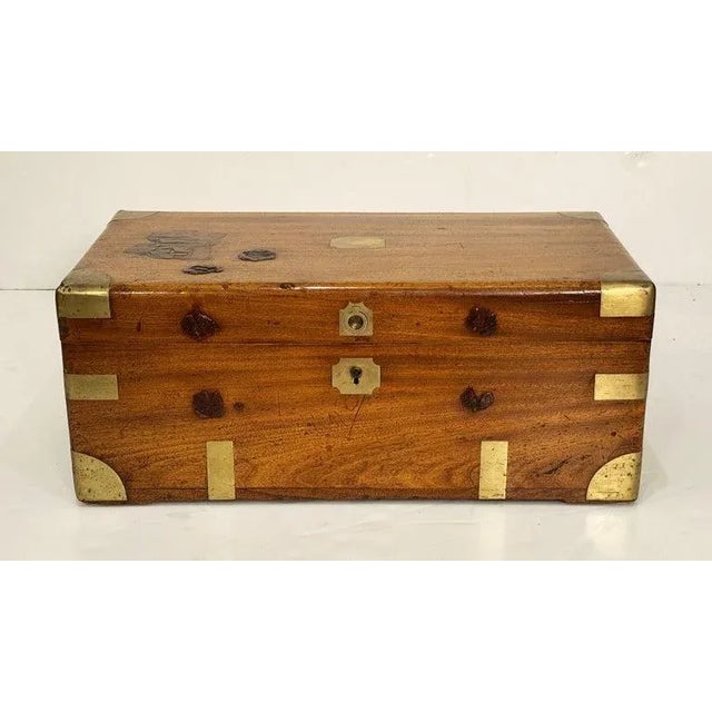 A handsome rectangular British military officer's Campaign trunk of camphorwood featuring hand-cut brass binding and...