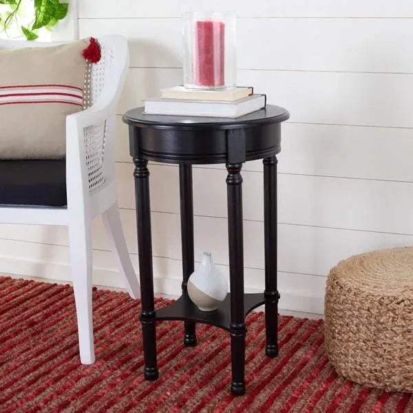 Flaunting depth and dimension in its tall open frame, this Tinsley Round Accent Table emanates elegant charm in any décor....