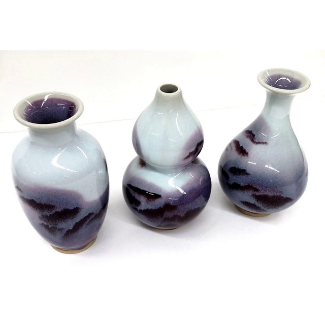 Gorgeous glaze effect on all 3 vases here in this collectible group. There are 3 styles of vases, all in the Chinese...