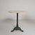 Elegant bistro table from the 1920s with a robust cast iron base and a luxurious marble top. The round marble top is glued...