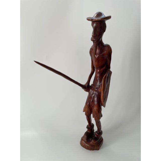 A vintage Don Quixote wood sculpture, hand carved and polished with beautiful detailing and natural wood grain. Circa...